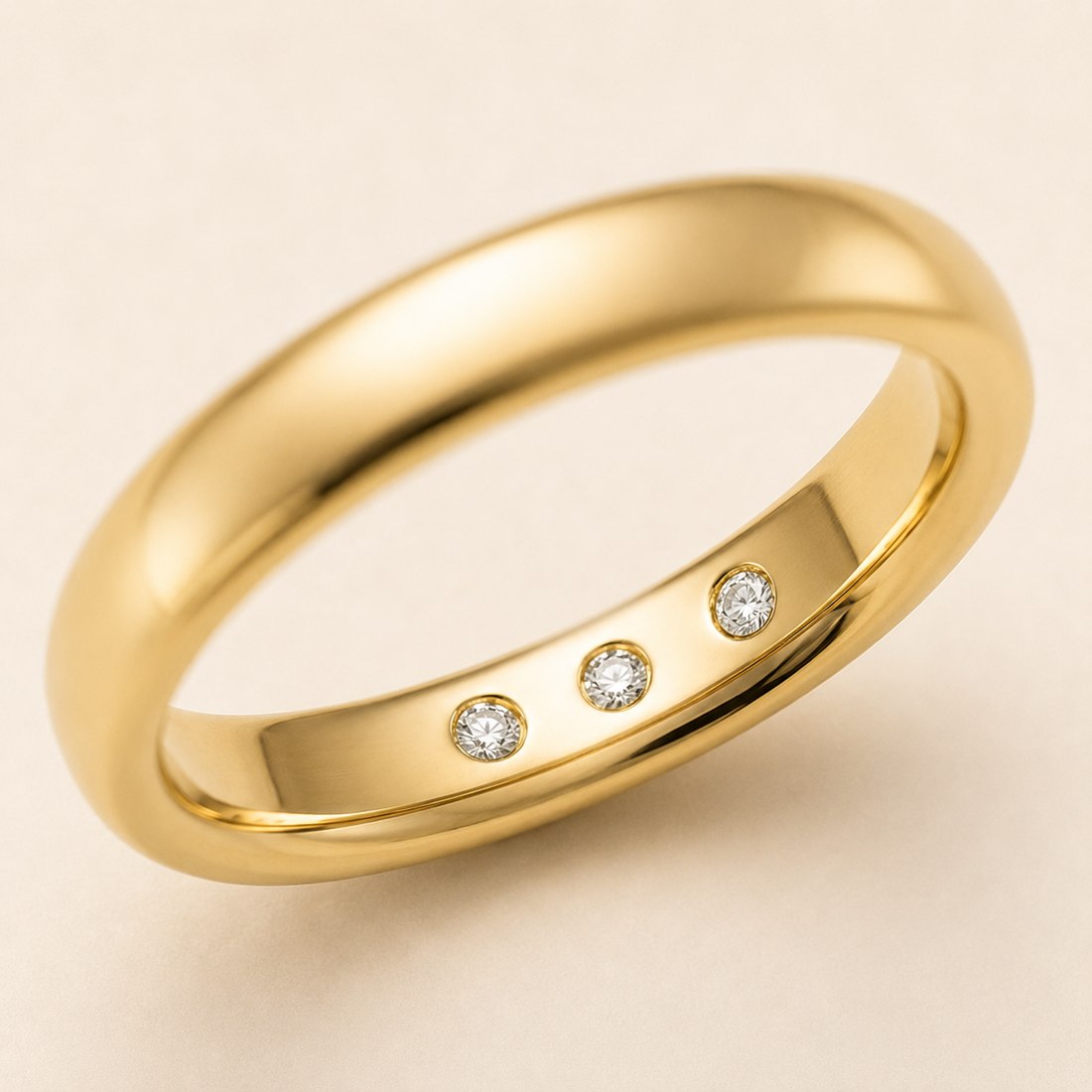 Embedded stones — three diamonds flush-set into the inner band
