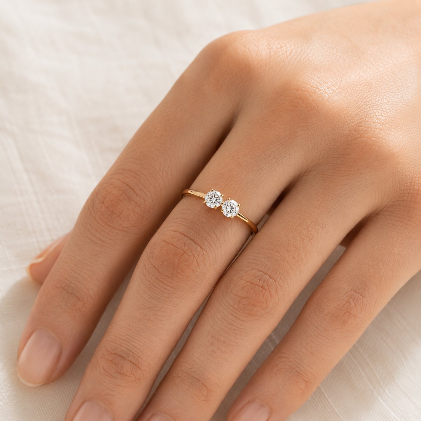 A toi et moi ring — two round-brilliant diamonds, one for each partner, on a fine gold band